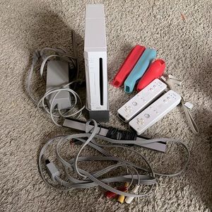 Wii with stand + cords + controllers and covers